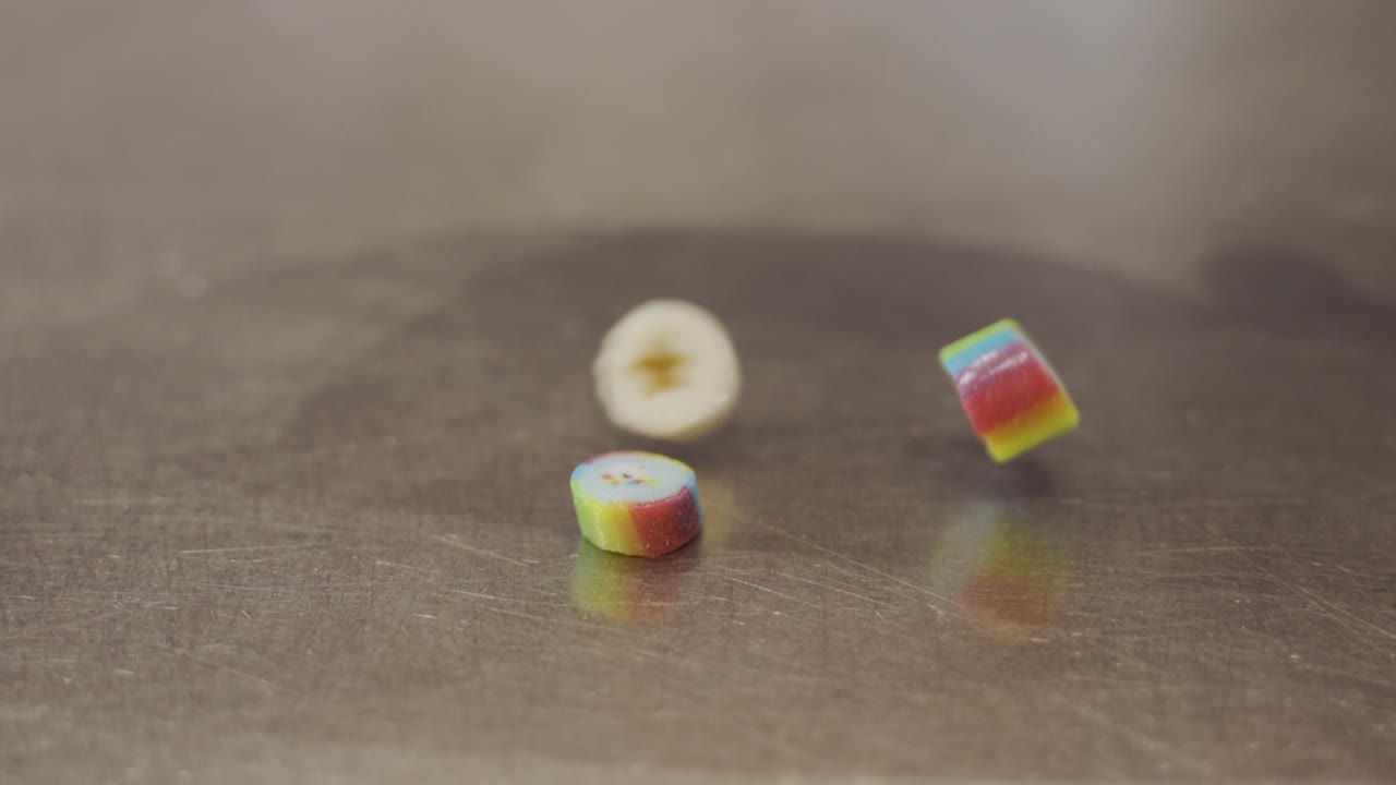 Colorful caramel candies bouncing and falling all over