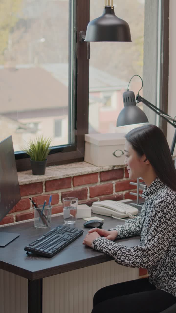 Person working on computer at desk