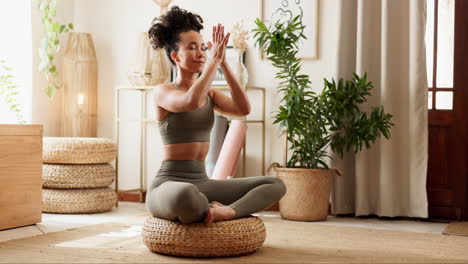 woman practicing yoga meditation at home