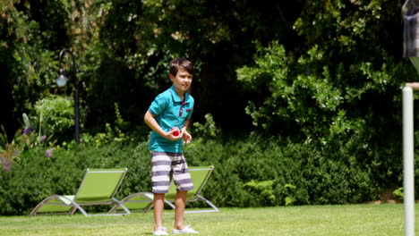 father and son playing cricket