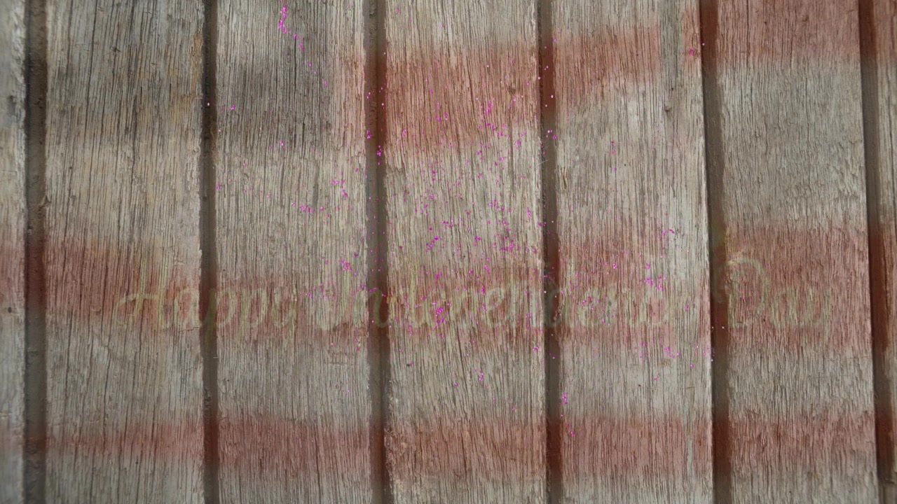 Animation of pink fireworks over happy independence day text and flag of america on wood panels