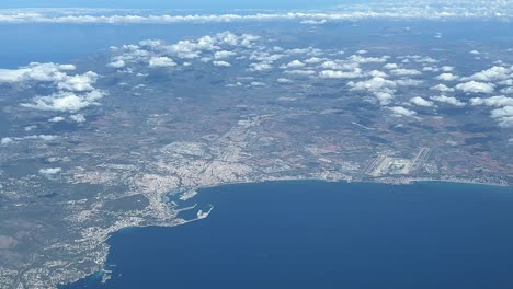 aerial view from palma de mallorca city and airport, shot from a jet cabin while flying at 10000m high