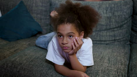 kid watching film at home