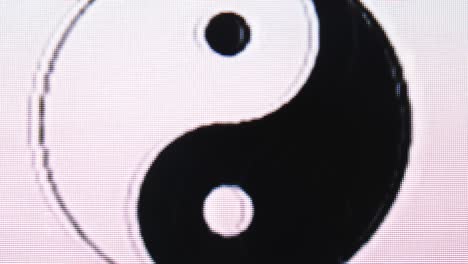 yin yang balance icon distorted on electronic screen