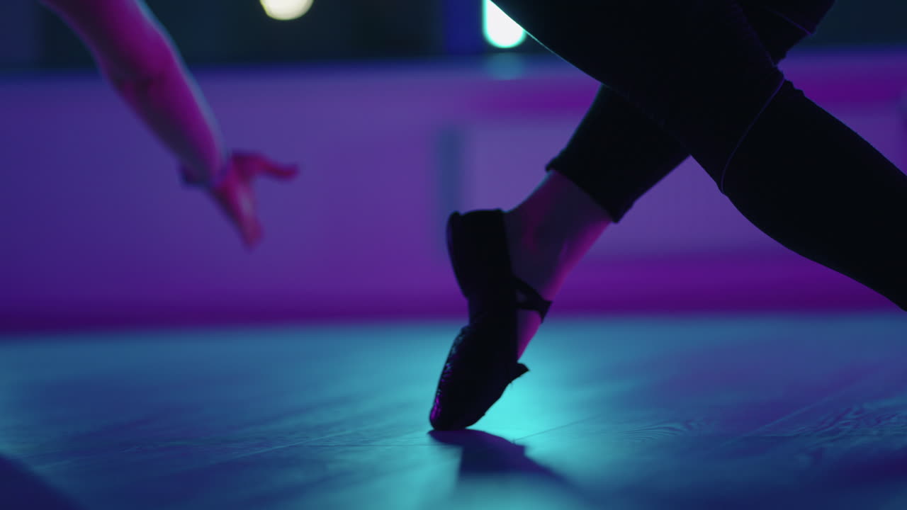 woman legs swaying above floor in fitness hall aerial yoga exercise details shot