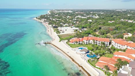 clear turquoise waters and sandy beach stretch along playa del carmen, mexico