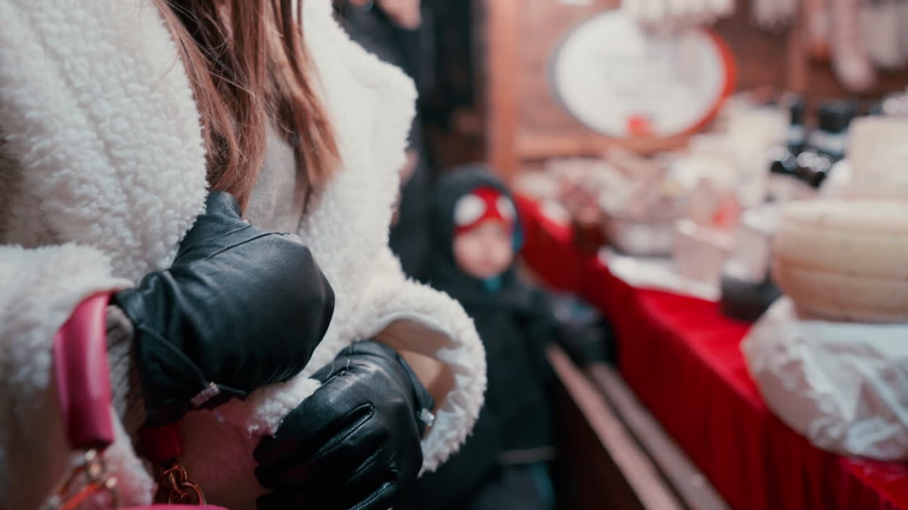 Close up of a woman's Hands covered with leather Gloves