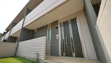 beige and brown modular home exterior design, day