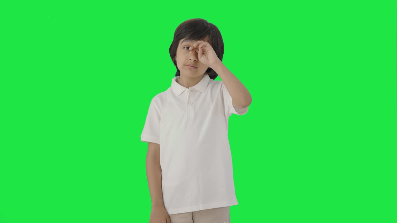 Tired Indian boy feeling sleepy and yawning Green screen