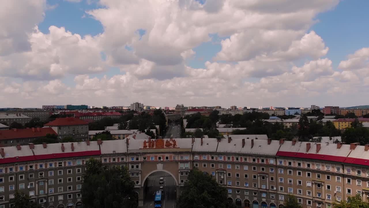 Oblouk aerial drone shot fly backwards tilt down, city of Poruba reveal. Socialistic realism building block in U shape,  built in comunism. Ostrava, Czech republic