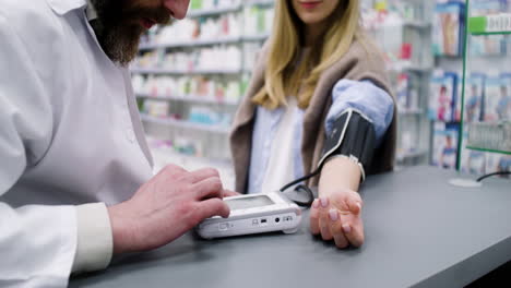 pharmacist checking blood pressure