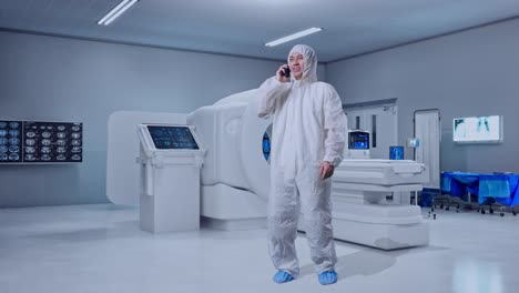 full body of asian male scientist talking on smartphone while standing with mri machine in the hospital