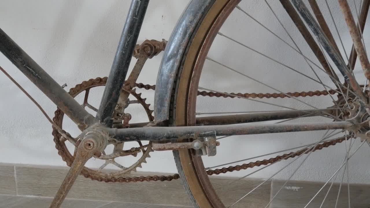 Rusty antique bicycle rear wheel close-up, showcasing vintage craftsmanship