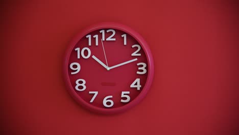 red wall clock on red background