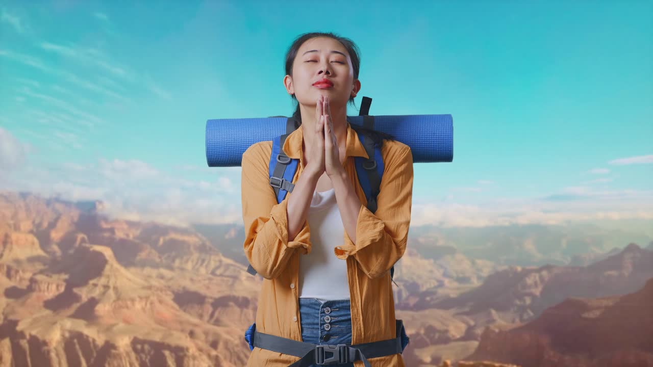 Asian Female Hiker With Mountaineering Backpack Pray For Something While Traveling At The Top Of Mountain