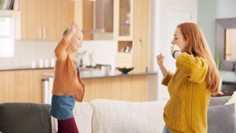 Mother,-girl-child-and-dancing-in-home