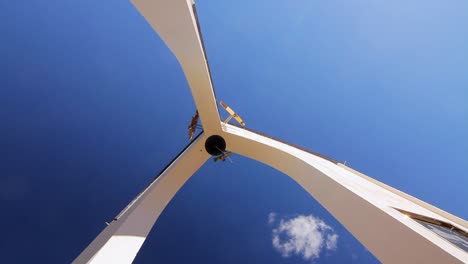 Bottom-view-of-high-white-bell-tower.-Bell-on-top-of-tower