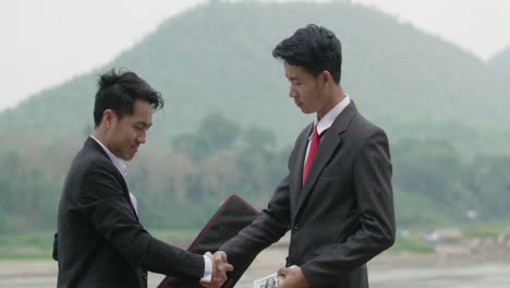 Business Deal by the River
