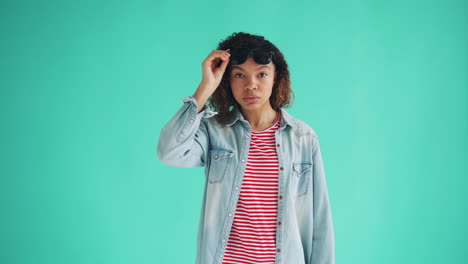 woman wearing denim jacket and striped shirt