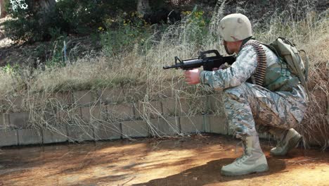 military soldier during training exercise with weapon