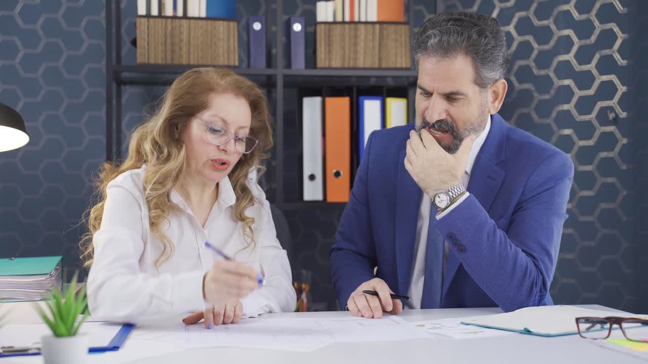 The manager who doesn't like the work of the woman working in the office.