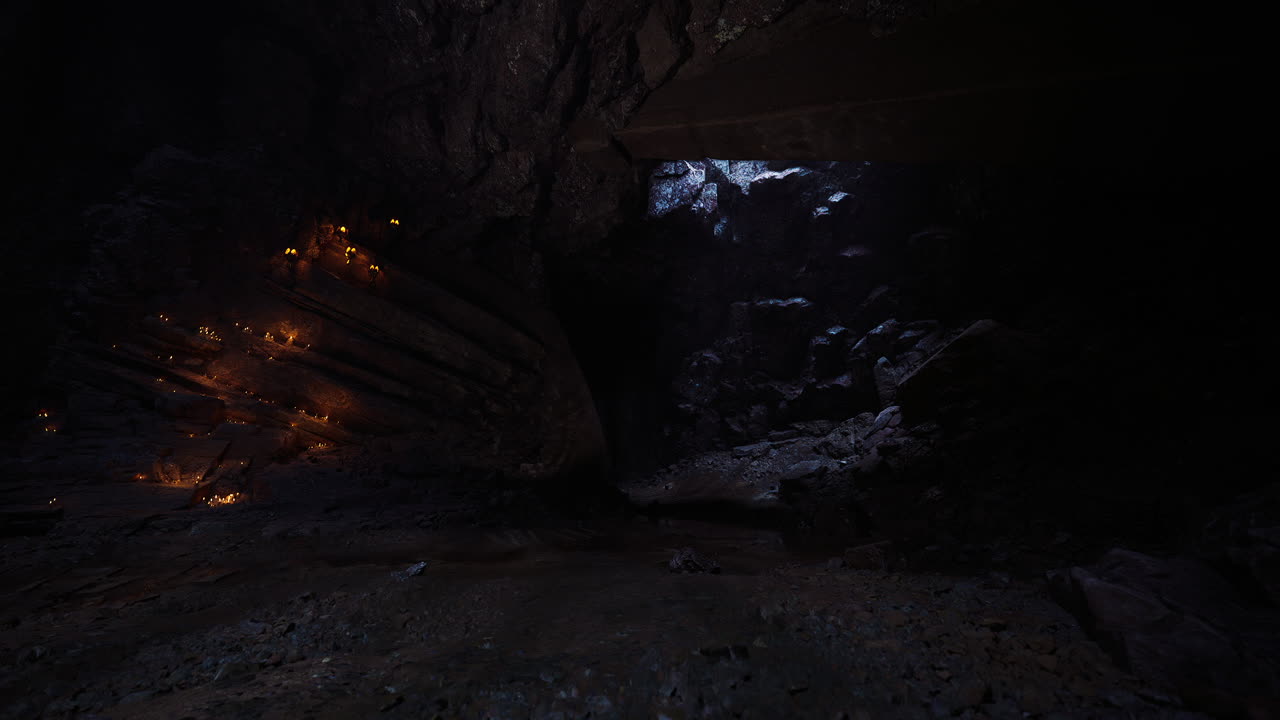 Mysterious cave with glowing rocks and dark shadows at twilight