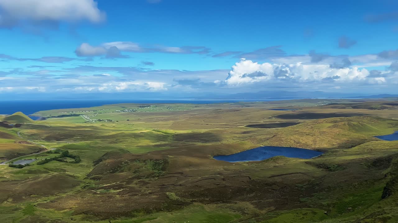 Mountain, Lake And Winding Road From Quiraing Viewpoint In Portree, Scotland, United Kingdom. - pan shot
