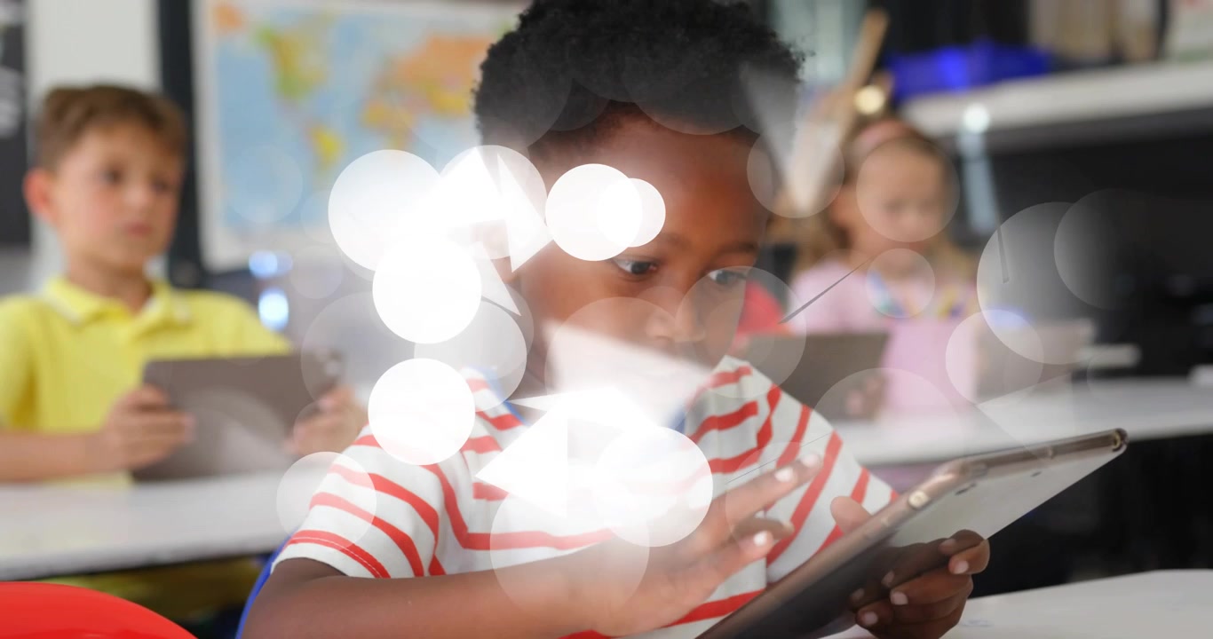 Student in school tapping tablet and causing glows partly obscuring view while peers learning