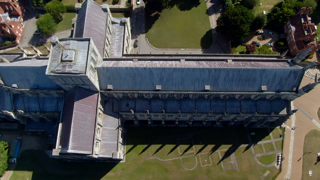 4K Bird's eye view shot of Winchester Cathedral, during Summer in Hampshire, UK