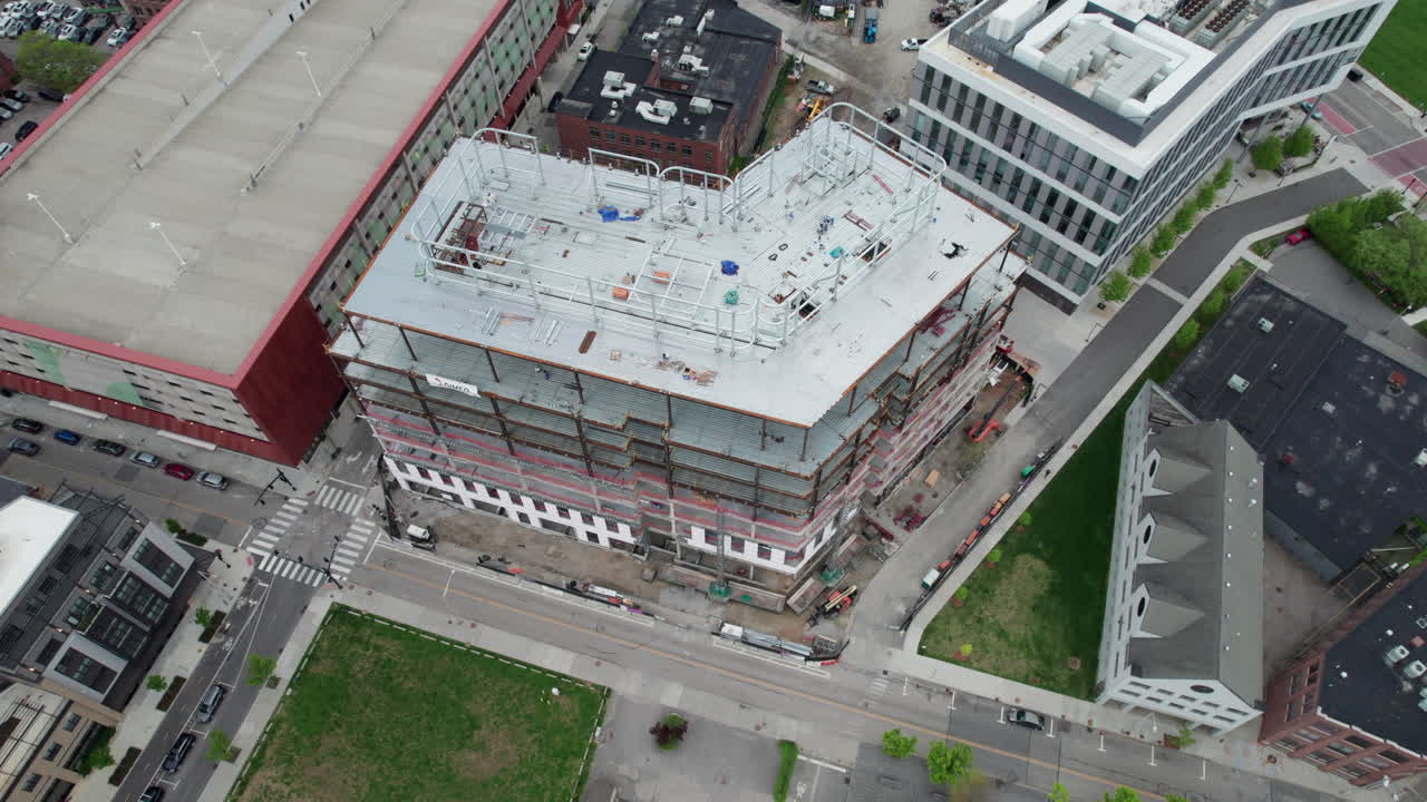 High top view, flying over a building under construction in the city.