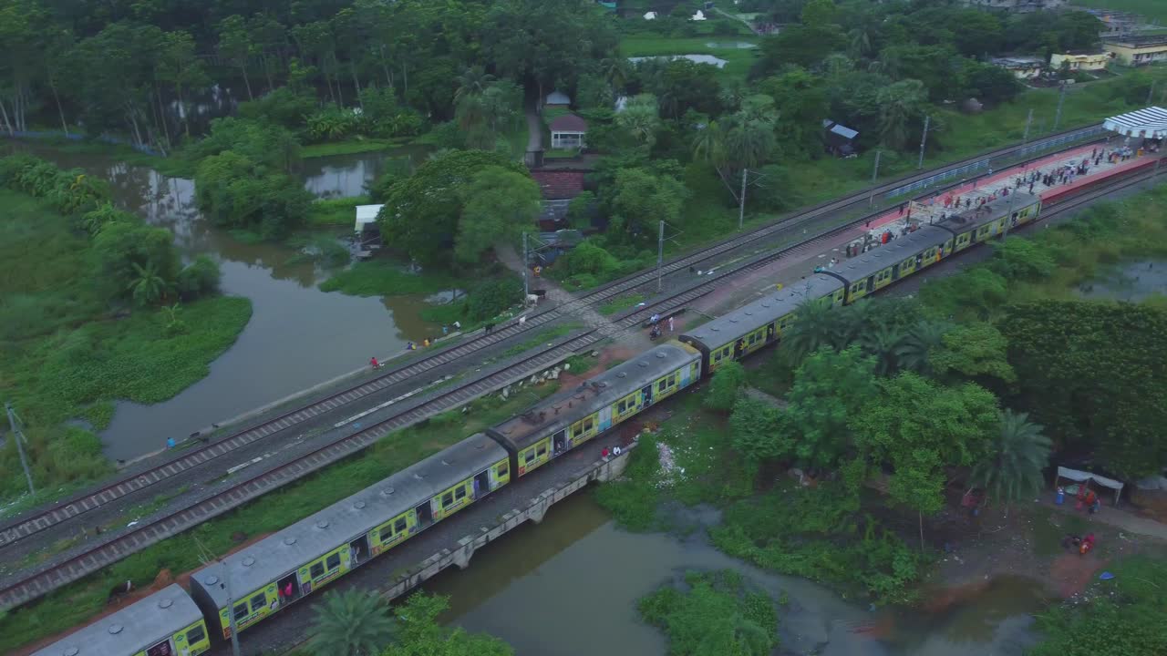 Aerial View of Train on Tracks in Rural Landscape