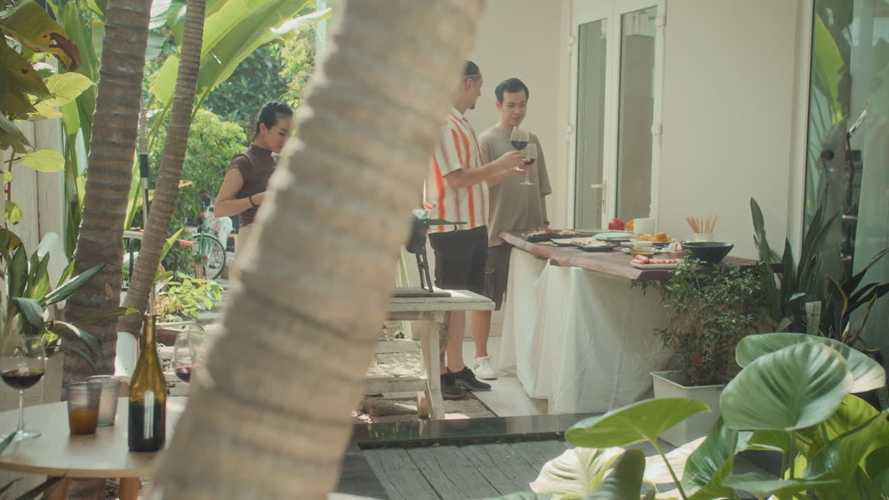 Group of People Cooking during Grill Party Outdoors