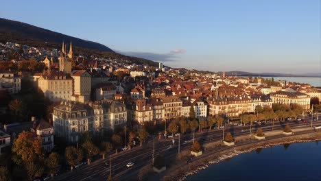 aerial view of the city of neuchâtel in switzerland, sunset on a fall day, castle of neuchâtel