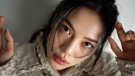 young asian model reaching towards camera in slow motion montage