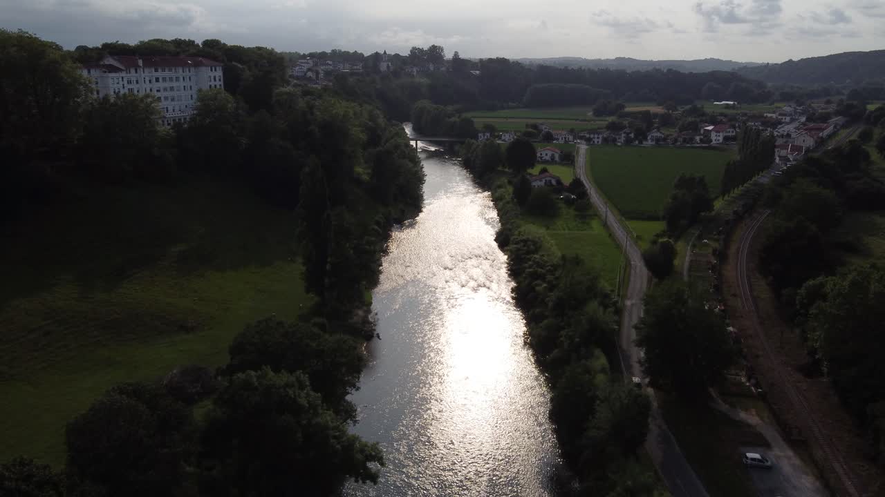 Aerial approach to Nive river and the village of Cambo les Bains, France