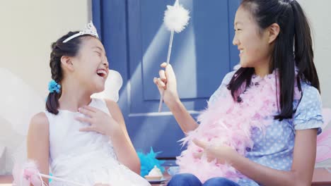 Siblings-in-fairy-costume-having-fun-at-outside-home-4k