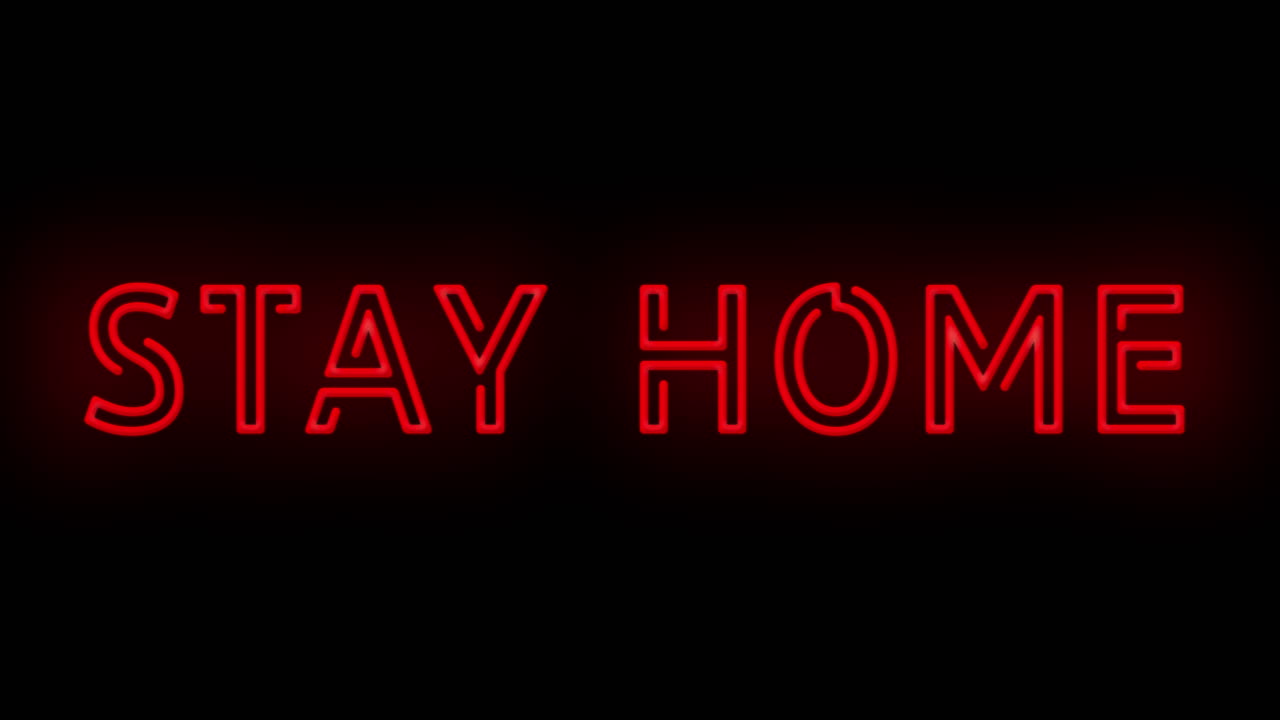 Flashing red STAY HOME Covid-19 Coronavirus sign on and off with flicker