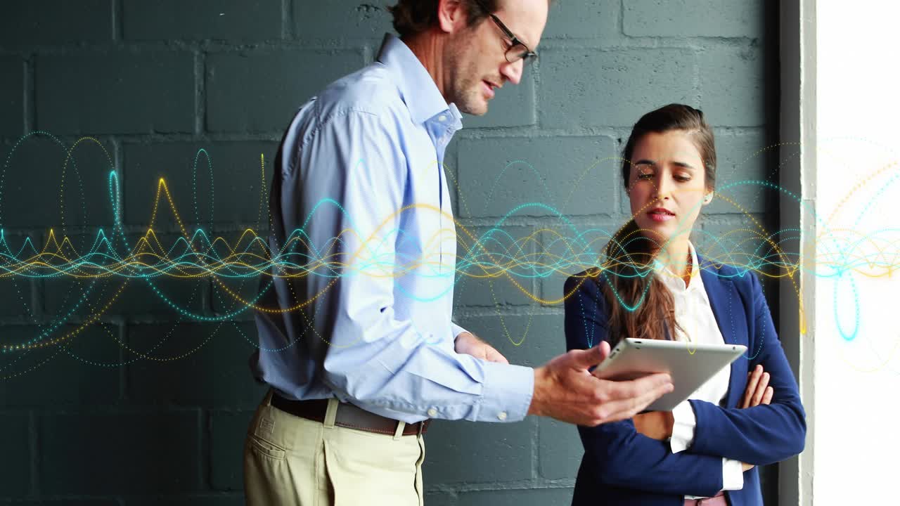 Man tapping tablet by window, woman taking tablet as animated metrics rising for business analytics