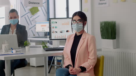 portrait of entrepreneur woman wearing face mask to prevent infection with covid19 virus
