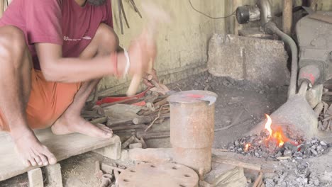 beat hammering sculpting shape of a raw coconut knife
