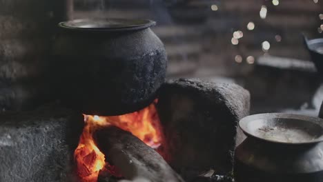 Iron-kettle-sits-on-top-of-an-open-fire