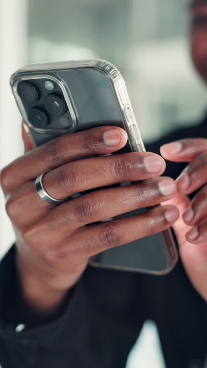 Close-up of Person's Hands Using a Smartphone