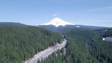 drone shot pushes out with a slight pan, focusing directly on mount bachelor