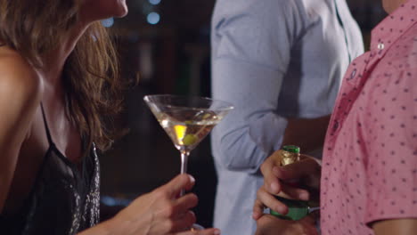 young man and woman holding drinks at a party, close up, shot on r3d