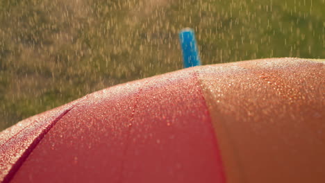 raindrops descend on parasol surface stylish and vibrant parasol stands as steadfast shield offering