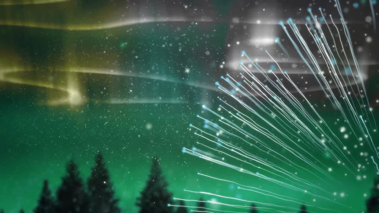 animación digital de nieve cayendo contra rastros de luz coloridos en el cielo nocturno