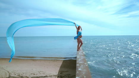 pregnant woman stand on breakwater. happy pregnancy concept