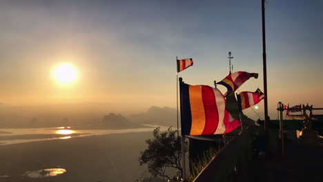 buddhist flags monastery top view mountain slow motion river sunset