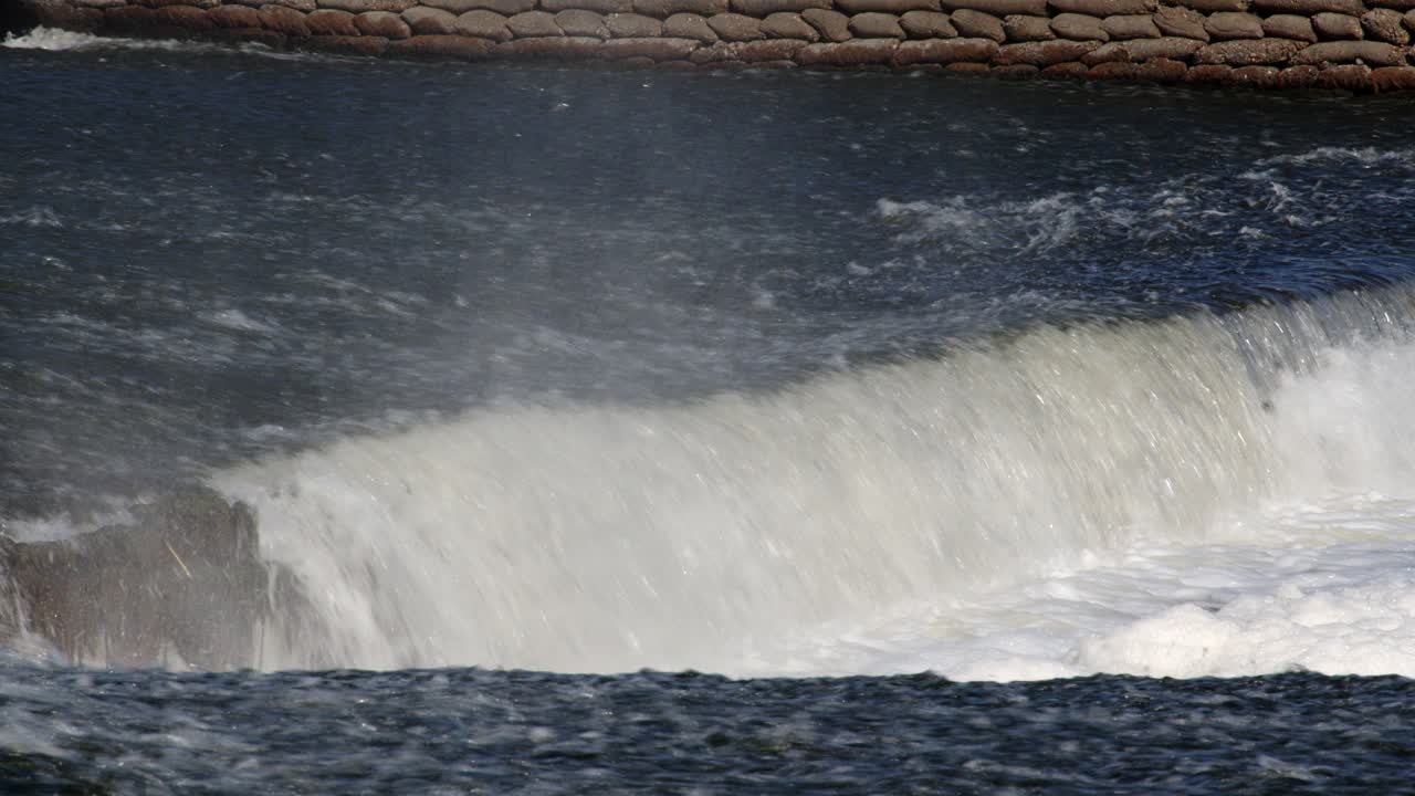 Showing the mid shot of the V-notch at the River Trent weir by By Ratcliffe on Soar Power station
