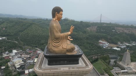 aerial view of a large golden buddha statue in taiwan